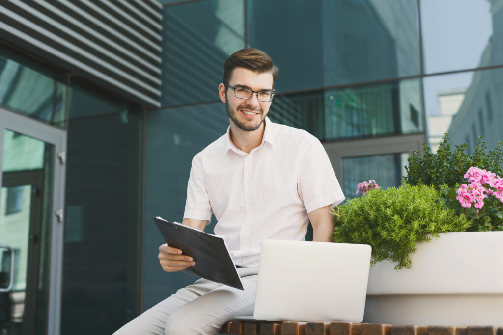 A young man working outside and developing as a professional