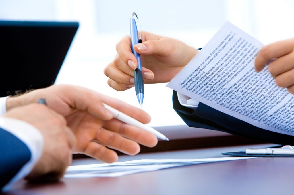 A direct marketing strategist discussing terms and conditions with a high-value client